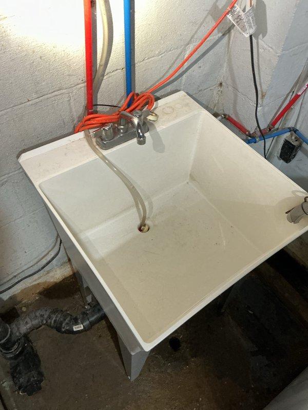 Responded to main drain backup in basement utility area. Successfully cleared obstruction from main drain line using professional drain cleaning equipment, restoring proper drainage flow throughout the system. Also replaced faulty shut-off valve under kitchen sink to prevent future leaks and ensure reliable water control.