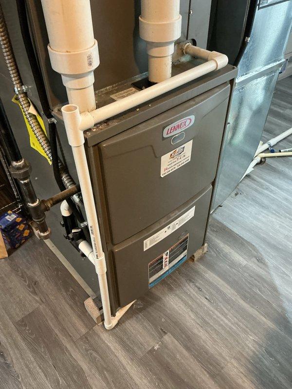 Responded to service call for a 10-year-old system making loud noises and failing to cool the home. Connected refrigerant gauges to the outdoor condenser unit to diagnose system performance and check refrigerant pressures. Customer may be interested in maintenance plan options.