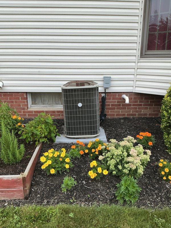 Completed full HVAC system installation including a 90% efficiency furnace and air conditioning unit. Installed new furnace with metal ductwork in basement utility area, ensuring proper ventilation and connection to existing duct system. Positioned exterior AC condenser unit on concrete pad against house foundation with proper clearance, connected refrigerant lines and electrical service, and installed PVC condensate drain line along exterior wall. System tested and verified operational with all components functioning within manufacturer specifications.