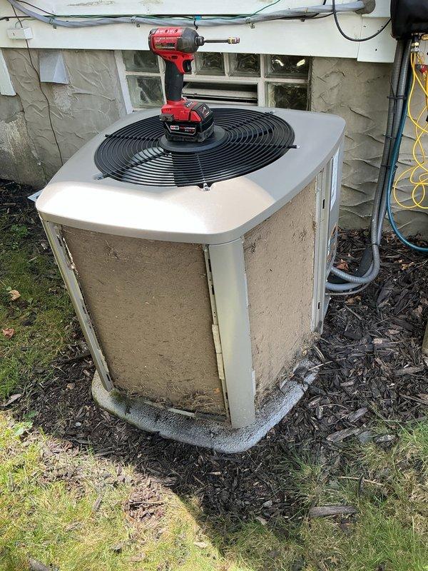 Completed MVP recurring cooling maintenance visit on residential air conditioning system. Performed comprehensive inspection of outdoor condenser unit, including removal of top panel to access internal components, inspection of fan motor and blade assembly, and verification of electrical connections. Cleaned condenser coil fins, checked refrigerant line insulation integrity, and confirmed proper unit operation upon completion.