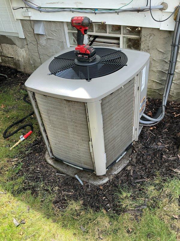 Completed MVP recurring cooling maintenance visit on residential air conditioning system. Performed comprehensive inspection of outdoor condenser unit, including removal of top panel to access internal components, inspection of fan motor and blade assembly, and verification of electrical connections. Cleaned condenser coil fins, checked refrigerant line insulation integrity, and confirmed proper unit operation upon completion.