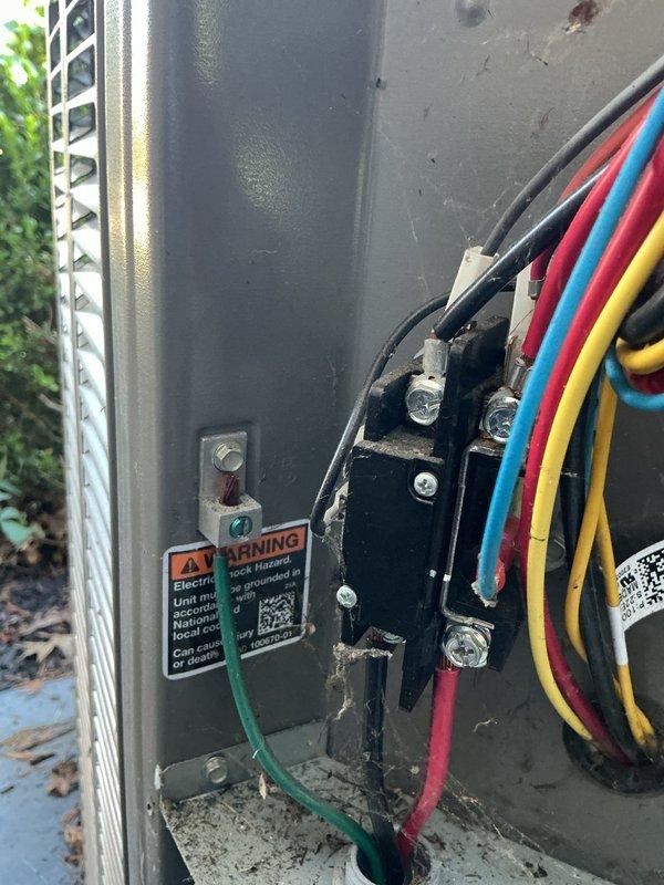 Completed routine MVP cooling maintenance visit on a 4-year-old HVAC system. Performed comprehensive inspection of outdoor condensing unit, including examination of electrical connections, contactors, and wiring within the disconnect panel. All electrical components, terminal blocks, and wire connections were found to be secure and functioning properly. Verified proper grounding and confirmed all safety warning labels were intact and visible. Inspected exterior disconnect box mounted on building exterior, noting normal weathering consistent with outdoor exposure. Documented equipment condition through photographic records for maintenance history. System operating within normal parameters with no immediate service needs identified.