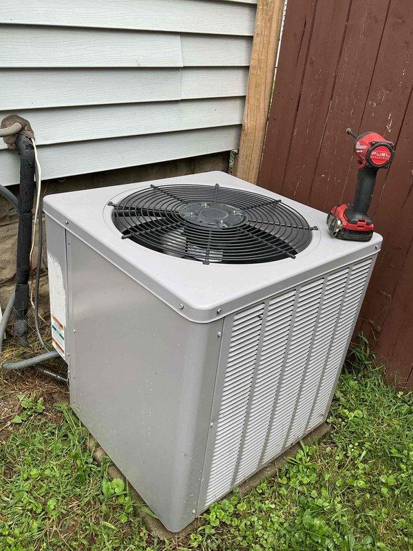 Responded to service call for 5-year-old residential air conditioning system experiencing inadequate cooling performance with temperature differential reading 10.5°F instead of the normal 18-20°F range. Performed comprehensive diagnostic evaluation of outdoor condenser unit and system components. Inspected condenser coils, refrigerant levels, airflow patterns, and electrical connections to identify cause of reduced cooling capacity. Documented equipment condition with photographs for service records.