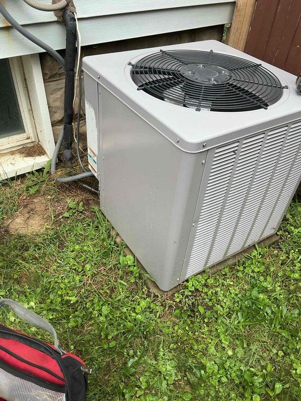 Responded to service call for 5-year-old residential air conditioning system experiencing inadequate cooling performance with temperature differential reading 10.5°F instead of the normal 18-20°F range. Performed comprehensive diagnostic evaluation of outdoor condenser unit and system components. Inspected condenser coils, refrigerant levels, airflow patterns, and electrical connections to identify cause of reduced cooling capacity. Documented equipment condition with photographs for service records.
