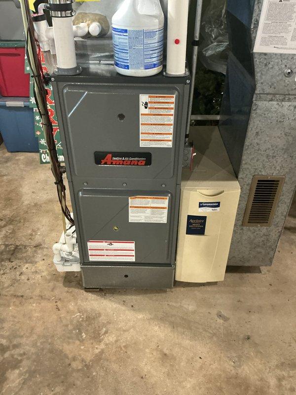 Completed recurring MVP maintenance visit on 2-year-old Amana furnace and air conditioning system. Performed comprehensive inspection of indoor furnace unit and outdoor condenser, verified all operational parameters, checked electrical connections and safety controls, inspected condensate drainage system and PVC venting, and confirmed proper system operation for both heating and cooling components.