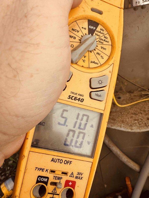 Performed routine cooling maintenance on a 9-year-old AC system that was operating properly. Conducted comprehensive tune-up including amperage readings using clamp meter, which showed 5.10 amps, and inspected evaporator coil fins for proper airflow and heat transfer efficiency.