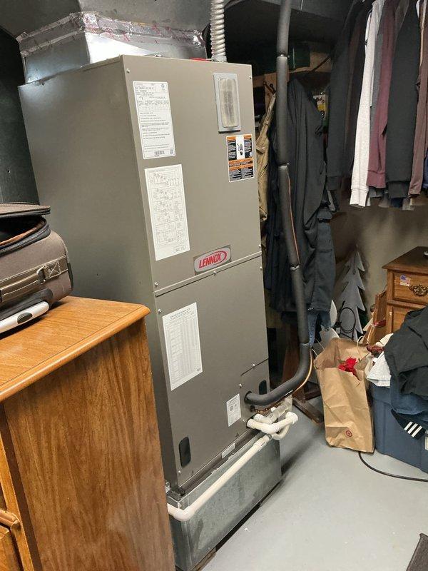 Performed comprehensive AC tune-up on residential split system with Lennox air handler located in basement and outdoor condensing unit. Completed full system inspection including electrical connections, refrigerant levels, and component functionality during scheduled preventive maintenance visit.