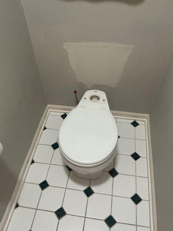 Installed customer-supplied toilet in bathroom with octagonal tile flooring, including replacement of shut-off valve with company-supplied valve. Completed installation per standard plumbing code requirements, ensuring proper sealing and water connection functionality.