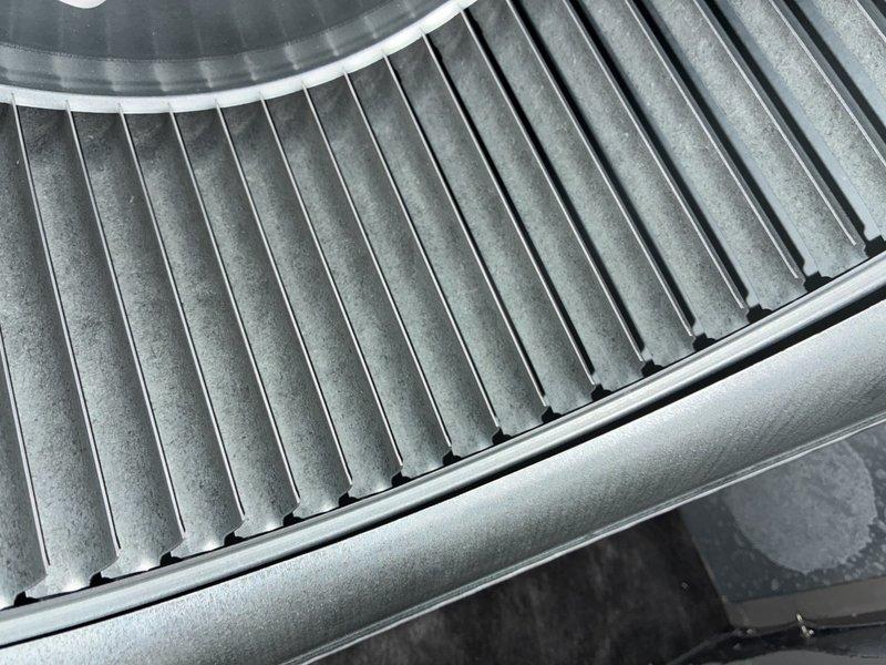 Performed preventative maintenance tune-up on a 2-year-old Lennox system to maintain warranty compliance. Inspected evaporator coil assembly and verified proper fin alignment and heat exchange surface condition, noting light dust accumulation on metallic fins. Accessed air handler compartment, inspected and evaluated pleated air filter showing normal dust accumulation for a residential system in service. Verified all system components operational with proper airflow through ductwork and filter housing. System confirmed working properly with no deficiencies noted during inspection.