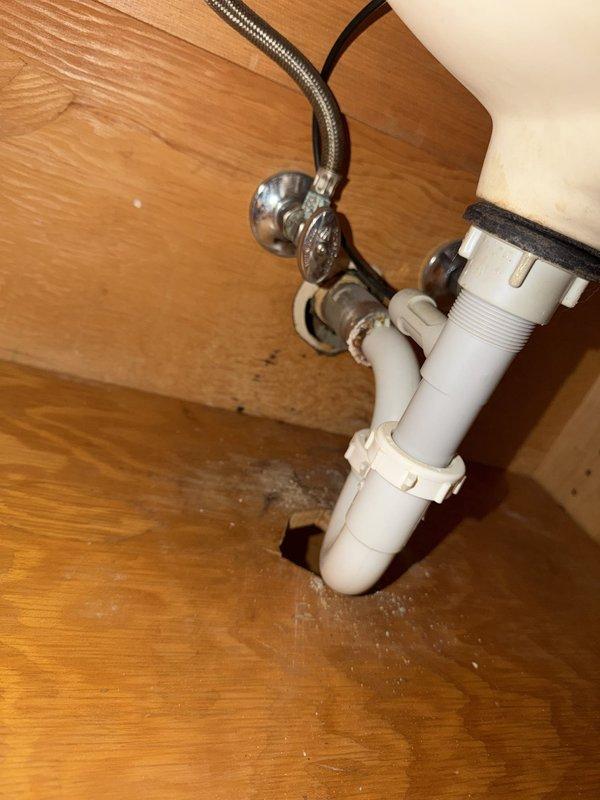 Responded to multiple drain blockages throughout residential property. Addressed upstairs hallway bathroom sink with complete clog and standing water by clearing obstruction from drain line and P-trap assembly. Cleared separate blockages in upstairs hallway traditional bathtub and north-side bedroom walk-in shower, both presenting with standing water due to complete drainage failure. Serviced downstairs powder room bathroom sink experiencing slow drainage from disuse and sediment accumulation. Inspected kitchen sink faucet connections for reported intermittent drip and tightened supply line fittings as needed. Verified proper drainage flow on all affected fixtures after clearing obstructions. All drains restored to normal operation with no additional issues identified on third upstairs walk-in shower which remained functional throughout.
