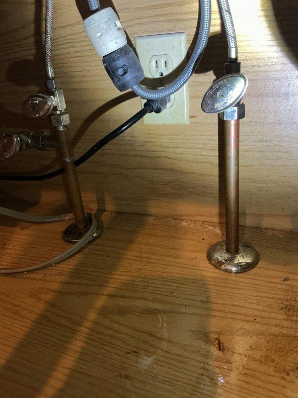 Responded to service call for estimate on installation of two local shut-off valves and repair of leaking pipe. Upon arrival, assessed existing plumbing configuration beneath kitchen sink, which consisted of copper supply lines with brass fittings mounted to wall. Inspected flexible braided stainless steel supply hoses connecting to fixture above. Identified areas requiring shut-off valve installation to provide localized water control for future maintenance and emergency situations. Examined leaking pipe connection points and compression fittings for signs of corrosion, wear, or improper sealing. Documented current plumbing setup with photographs showing copper pipe condition, mounting brackets, and supply line routing. Provided detailed estimate for installation of two quarter-turn angle stop valves on hot and cold water supply lines, along with repair work needed to address active leak. Explained benefits of adding local shut-off capability to minimize water damage risk during futur