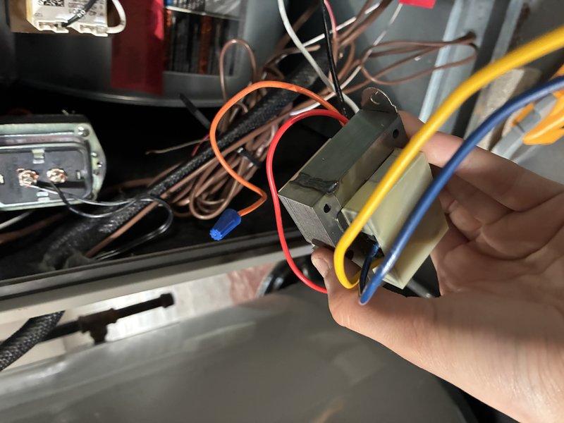 Responded to customer report of whistling sound from air conditioning system. Performed diagnostic inspection of unit, examining electrical connections, wiring terminals, and internal components. Inspected blower motor assembly, electrical control board connections, and wire harness for loose connections or vibration-related issues that could cause audible noise. Documented system condition with photos of electrical components and wiring connections for service records.