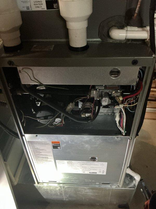 Responded to no cooling call with E201 error code displayed on 2-year-old system. Upon arrival, confirmed outdoor unit running but no airflow throughout home. Customer reported lines had frozen while away and had already defrosted unit, replaced filters, and reset breakers without resolution.

Accessed indoor air handler and inspected blower assembly and control board. E201 error code indicated blower motor failure or communication fault. Performed diagnostic testing on blower motor and found motor had failed, preventing air circulation through system. Verified all electrical connections to motor and control board were secure. Checked capacitor and confirmed outdoor unit components functioning properly, but lack of indoor airflow had caused evaporator coil to freeze initially.

Removed failed blower motor assembly from air handler cabinet. Installed new replacement blower motor with proper specifications for unit. Reconnected all wiring harnesses to motor and control board terminals. C