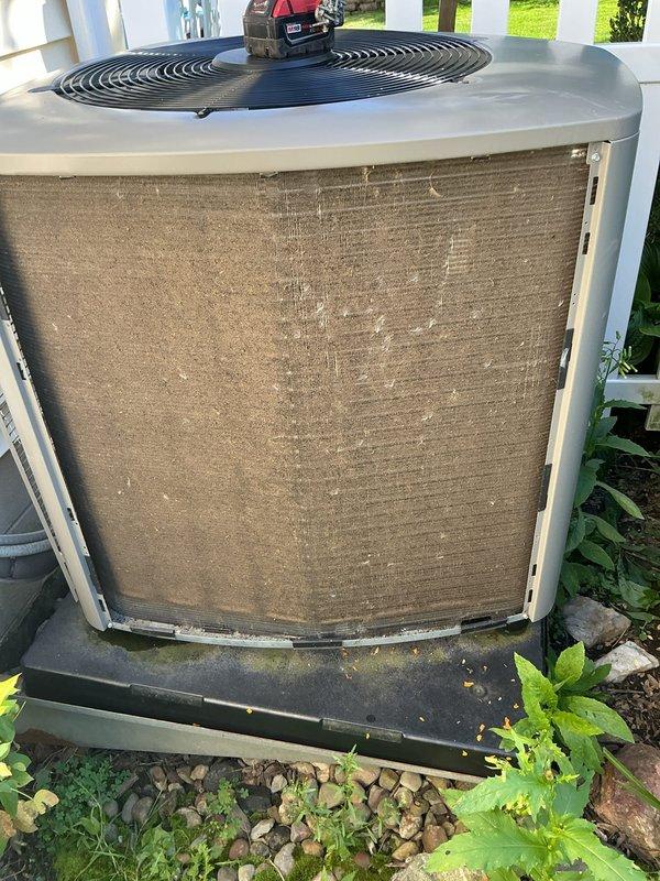 Completed comprehensive preventative maintenance on residential central air conditioning system. Performed standard AC tune-up procedures including inspection of condenser unit, verification of refrigerant levels, electrical connections check, and system operational testing. Exterior condenser unit showed moderate dust and debris accumulation on intake screen, which was cleaned to restore optimal airflow. Inspected condensate drainage system including PVC discharge lines and flexible drain hose for proper function and clearance. All components found operating within normal parameters with no deficiencies noted. System confirmed functioning properly with no repairs required.