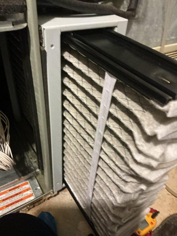 Completed routine MVP heating maintenance visit on 11-year-old system. Inspected furnace components, replaced dirty air filter with visible dust accumulation, and examined internal electrical connections and wiring. Noted significant dust and lint buildup on horizontal metal surfaces within the unit that was documented for maintenance records.
