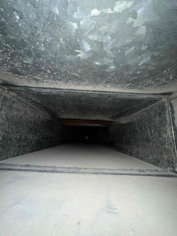 Completed comprehensive duct cleaning service for residential HVAC system. Upon inspection, discovered heavy accumulation of dust, debris, and particulate matter throughout the ductwork, with particularly dense buildup on ceiling surfaces and walls showing fibrous coating and visible clumping. Performed thorough cleaning of all accessible ductwork using professional-grade equipment to remove contaminants and restore proper airflow. System showed evidence of extended operation without maintenance, with significant improvement in duct cleanliness achieved upon completion.