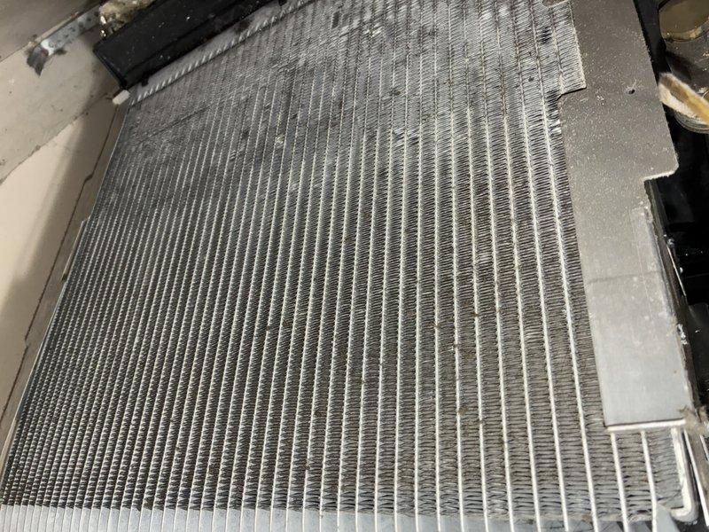 Performed comprehensive tune-up on 15-year-old furnace system. Inspected evaporator coil and noted moderate to heavy dust and debris accumulation on fin surfaces, which was affecting system airflow and efficiency. Cleaned coil assembly, checked refrigerant lines and connections, verified electrical components, and ensured all mechanical systems were operating within manufacturer specifications. System restored to optimal performance with improved airflow through heat exchanger.