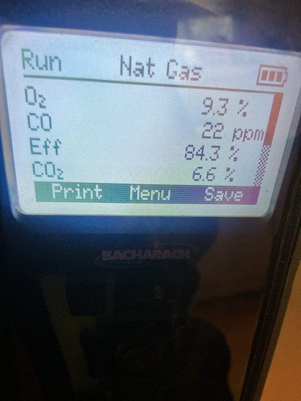 Completed comprehensive furnace tune-up and winter readiness inspection on 4-year-old unit. Performed combustion analysis using Bacharach analyzer, recording oxygen levels at 9.3%, carbon monoxide at 22 ppm, efficiency at 84.7%, and carbon dioxide at 6.6%. Inspected evaporator coil and heat exchanger fins, noting minor surface discoloration but no operational concerns. Verified all gaskets and seals intact between air handling components. System operating within normal parameters with no issues found; unit confirmed ready for heating season.