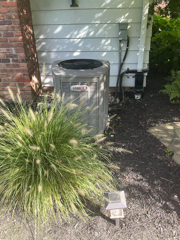 Performed scheduled maintenance on a 9-year-old Lennox air conditioning system. Inspected outdoor condensing unit, accessed internal components including capacitor and electrical connections, verified proper wiring configuration, and examined refrigerant lines to ensure system operational readiness for the cooling season.