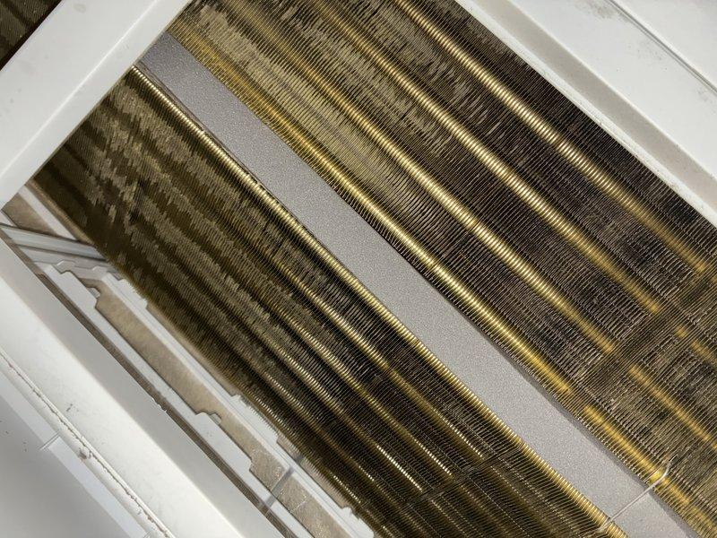 Completed comprehensive tune-up service on a 3-year-old heat pump system. Inspected evaporator coil assembly and found moderate dust accumulation on fins; noted varying degrees of discoloration on copper surfaces. Removed and inspected air filter, which showed significant dirt and debris buildup throughout multiple compartments, indicating reduced airflow efficiency. Replaced dirty filter with new unit to restore proper system airflow and performance. All components operational and system running within normal parameters upon completion.