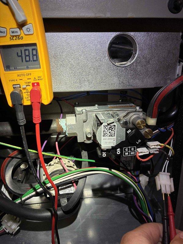 Completed comprehensive heating maintenance on a 6-year-old furnace system. Performed diagnostic testing of gas valve assembly and electrical components using digital multimeter, confirming proper voltage readings at 48.8V. Inspected heat exchanger coils, burner assembly, and all wiring connections; verified system operation and safety controls functioning within manufacturer specifications.