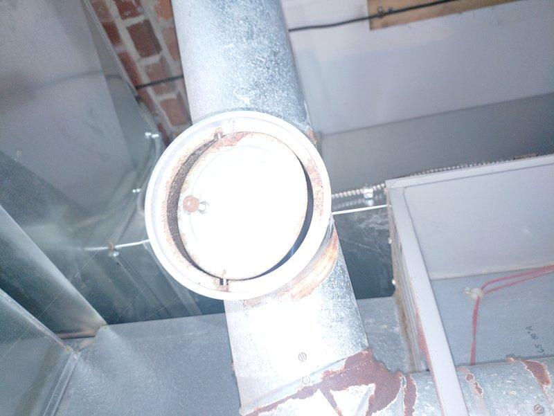 Completed routine oil system maintenance and inspection. System was found to be operating properly with all components functioning as designed. Documented existing rust staining around ductwork access panel and general condition of HVAC equipment for customer records.