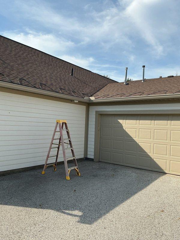 Installed two separate runs of roof heat tape on residential property: one above garage and adjacent section, and one on rear U-shaped roof section. Heat tape was properly installed in back-and-forth pattern along roof eaves and valleys, extending into gutters and down downspouts per manufacturer specifications. Connected first run to existing dedicated 20-amp circuit and second run to existing 15-amp circuit after verifying amperage calculations confirmed adequate capacity for safe operation.
