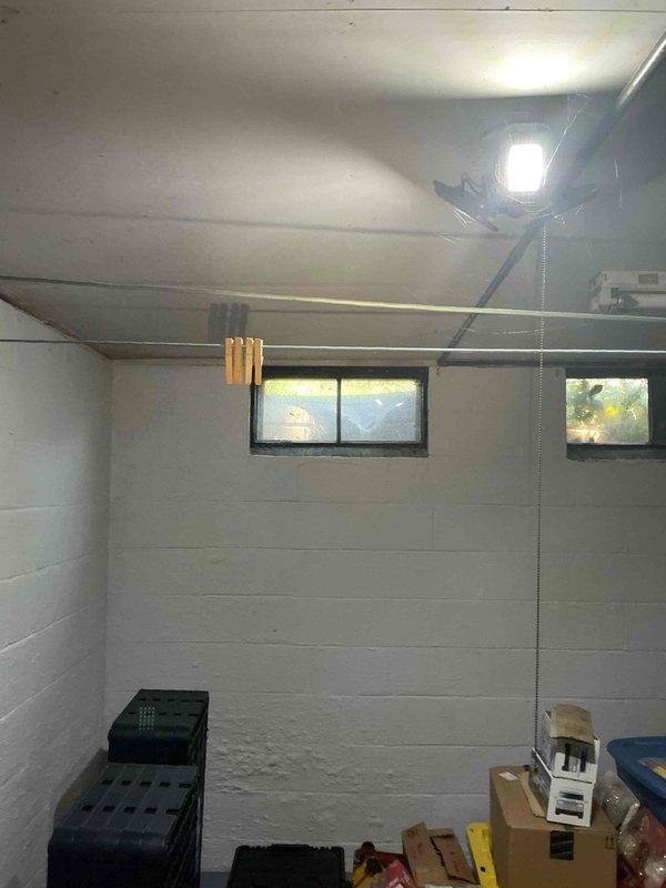 Conducted on-site assessment for Kohler generator installation in basement utility area. Evaluated existing electrical infrastructure, including main service panel location and available space for generator placement and associated equipment. Documented installation site conditions, including exposed ceiling joists, concrete block walls, and current HVAC ductwork routing to determine optimal generator positioning and required electrical connections for automatic transfer switch integration.