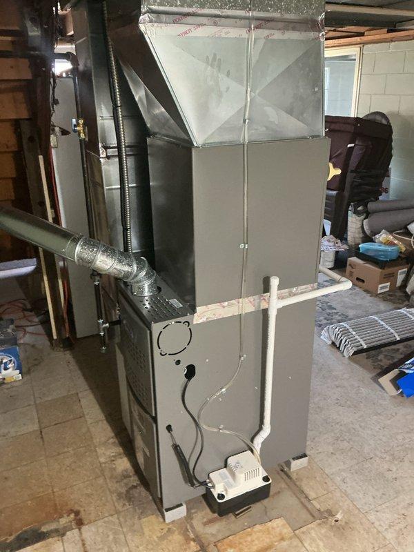 Completed seasonal AC tune-up on residential HVAC system. Inspected furnace unit, replaced air filters with new AprilAire filters, and verified proper operation of all system components including ductwork connections and condensate drainage system.