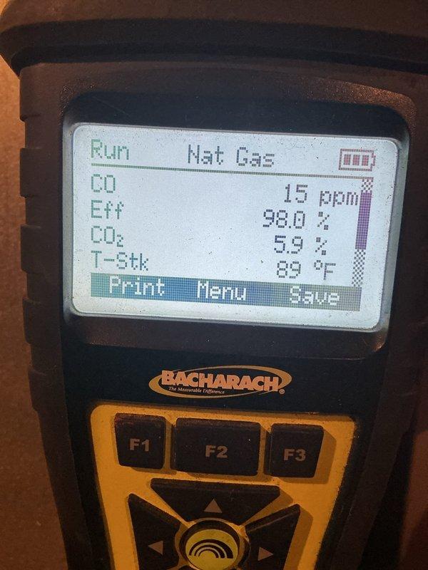 Completed scheduled heating maintenance on a 9-year-old natural gas furnace. Performed comprehensive system inspection including combustion analysis using calibrated digital analyzer. Verified optimal combustion efficiency at 98.0% with carbon monoxide levels reading 15 ppm, CO₂ at 59%, and stack temperature at 89°F - all within manufacturer specifications for safe and efficient operation. Inspected blower motor assembly, electrical connections, and internal components with access panel removed. Checked PVC venting system for proper installation and secure connections. All mechanical and safety systems operating as designed with no deficiencies noted.
