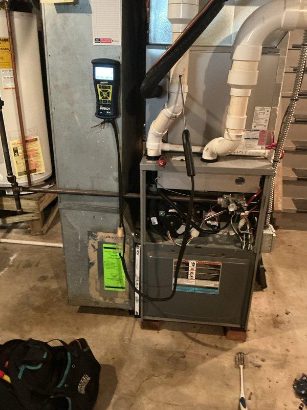 Completed scheduled heating maintenance on a 9-year-old natural gas furnace. Performed comprehensive system inspection including combustion analysis using calibrated digital analyzer. Verified optimal combustion efficiency at 98.0% with carbon monoxide levels reading 15 ppm, CO₂ at 59%, and stack temperature at 89°F - all within manufacturer specifications for safe and efficient operation. Inspected blower motor assembly, electrical connections, and internal components with access panel removed. Checked PVC venting system for proper installation and secure connections. All mechanical and safety systems operating as designed with no deficiencies noted.
