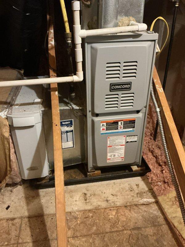 Responded to no cooling call on 9-year-old Ducane air conditioning system with thermostat displaying no power. Diagnosed low voltage power supply issue preventing thermostat operation and system startup. Traced wiring from thermostat through basement to air handler and identified failed transformer supplying 24VAC control voltage to thermostat and system controls. Replaced defective transformer, verified proper voltage output at thermostat terminals, and confirmed system restored to normal operation with adequate cooling capacity.
