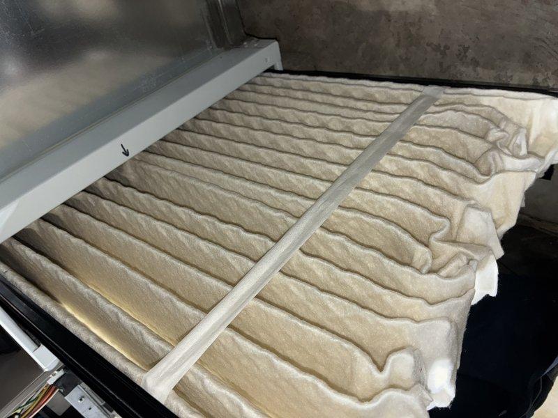 Completed MVP heating maintenance visit and system inspection. Examined heat exchanger interior, which showed signs of oxidation and mineral deposits with rust-colored accumulation at the base requiring monitoring. Inspected and documented HVAC air filter condition, noting dust accumulation on pleated media indicating normal operation since last service interval.