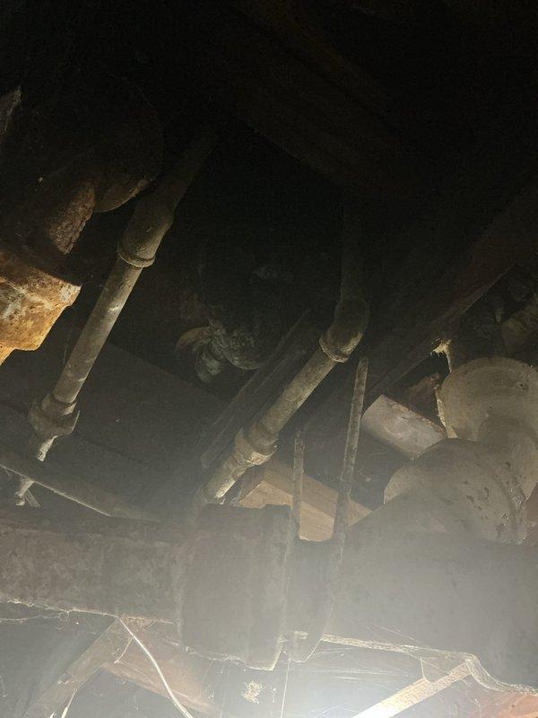 Responded to clogged bathtub drain at duplex property. Coordinated with landlord to ensure both tenants were present for inspection. Upon arrival, contacted customer with preliminary findings as requested. Performed thorough assessment of drainage system, including inspection of accessible plumbing infrastructure beneath the unit. Documented existing conditions showing aged piping with visible corrosion on metal components and PVC drain lines in crawl space. Addressed the bathtub blockage and verified proper drainage function upon completion.