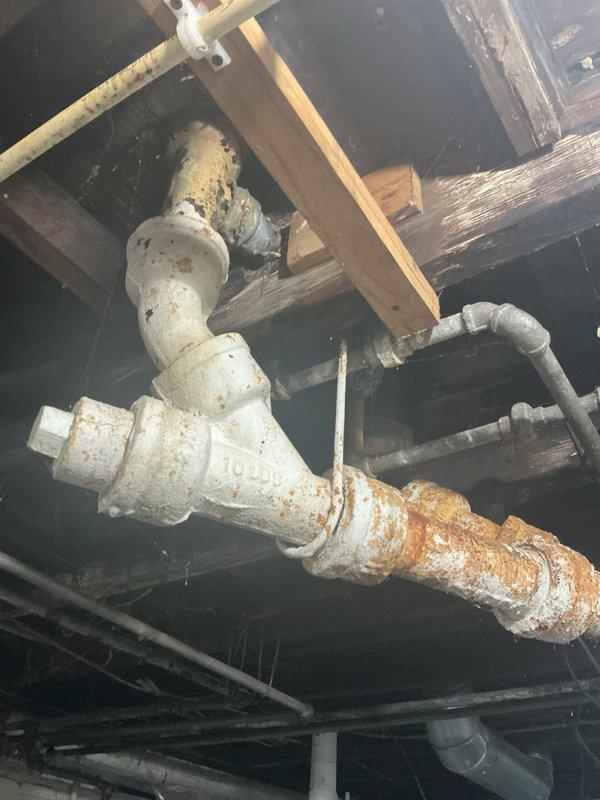 Responded to clogged bathtub drain at duplex property. Coordinated with landlord to ensure both tenants were present for inspection. Upon arrival, contacted customer with preliminary findings as requested. Performed thorough assessment of drainage system, including inspection of accessible plumbing infrastructure beneath the unit. Documented existing conditions showing aged piping with visible corrosion on metal components and PVC drain lines in crawl space. Addressed the bathtub blockage and verified proper drainage function upon completion.