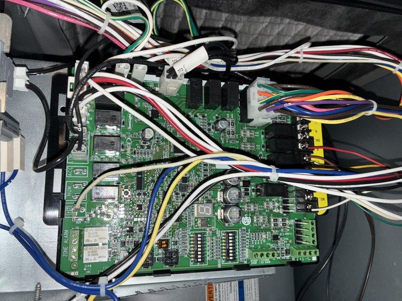 Completed comprehensive MVP air conditioning maintenance service including thorough inspection of evaporator coil assembly and control board systems. The evaporator coil showed moderate dust and debris accumulation between the fins, which was cleaned to restore optimal airflow and heat transfer efficiency. Inspected dual-board electronic control system, verified all wire harness connections, terminals, and surface-mounted components were secure and functioning properly to ensure reliable system operation throughout the cooling season.