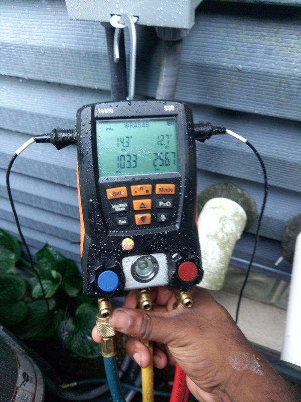 # AC Installation Completion

Successfully completed the second phase of a split system air conditioning installation. Installed new evaporator coil and connected refrigerant lines to the outdoor condensing unit. Performed vacuum and refrigerant charge procedures on the system. 

Upon completion, conducted full system diagnostics using digital manifold gauges to verify proper refrigerant pressures and system operation. Measured operating pressures with readings indicating 143 PSI on the low side and 256 PSI on the high side, confirming appropriate charge levels for ambient conditions. System temperatures and superheat/subcooling values were within manufacturer specifications.

Verified outdoor condensing unit installation on proper pad with adequate clearance from structure and vegetation. Confirmed all electrical connections are secure and unit is operating efficiently. System tested and left in full operational status.