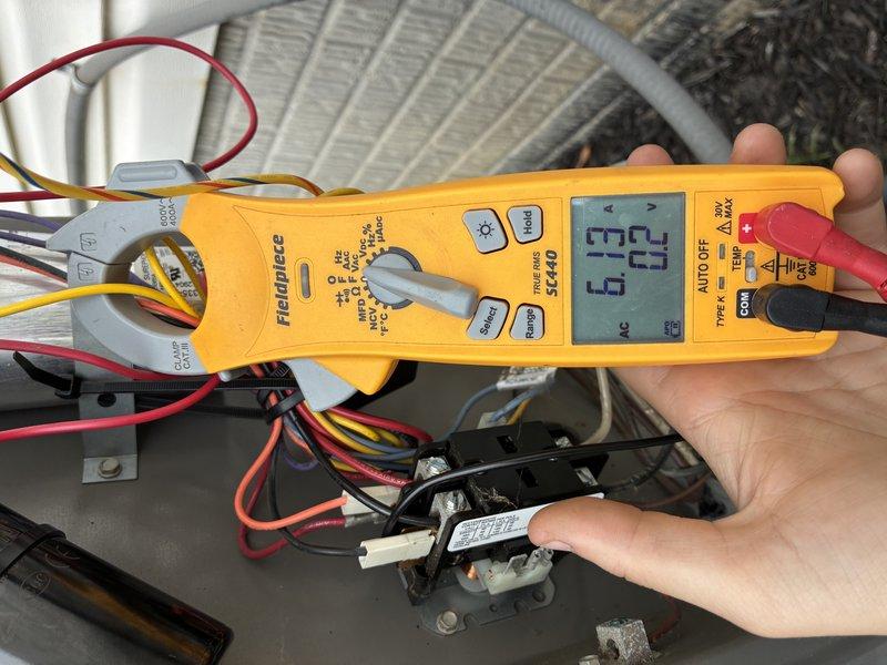 Responded to service call for unusual noise reported following recent maintenance. Upon arrival, performed comprehensive electrical diagnostics on air conditioning system. Used digital multimeter to measure voltage and amperage at contactor and capacitor connections to identify potential electrical issues causing abnormal operation. 

Inspected evaporator coil assembly and all electrical components within air handler cabinet. Verified proper voltage readings at contactor terminals and checked capacitor functionality. Examined all wire connections including control wiring (red, yellow, black, and white) for loose connections or damage that could cause unusual sounds. All electrical measurements were within normal operating parameters. Checked contactor operation and relay function to ensure proper cycling. Unit tested and operating normally at time of departure with no abnormal noise detected during observation period.