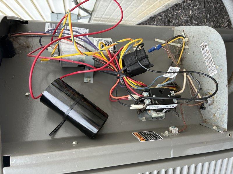 Responded to service call for unusual noise reported following recent maintenance. Upon arrival, performed comprehensive electrical diagnostics on air conditioning system. Used digital multimeter to measure voltage and amperage at contactor and capacitor connections to identify potential electrical issues causing abnormal operation. 

Inspected evaporator coil assembly and all electrical components within air handler cabinet. Verified proper voltage readings at contactor terminals and checked capacitor functionality. Examined all wire connections including control wiring (red, yellow, black, and white) for loose connections or damage that could cause unusual sounds. All electrical measurements were within normal operating parameters. Checked contactor operation and relay function to ensure proper cycling. Unit tested and operating normally at time of departure with no abnormal noise detected during observation period.