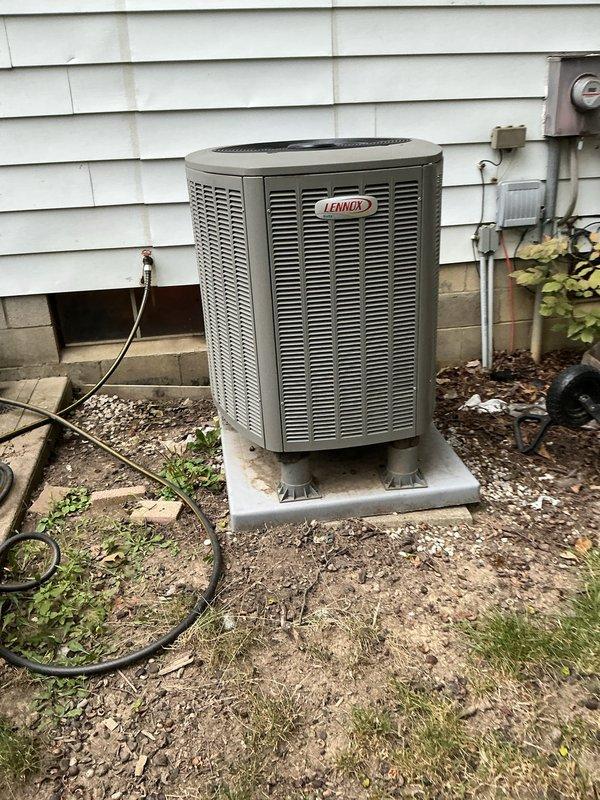 Completed MVP cooling maintenance visit on Lennox air conditioning system. Performed comprehensive inspection of outdoor condenser unit, verified proper operation of all components, and documented equipment condition with photos showing unit positioned on concrete pad with Diversitech disconnect box properly mounted on exterior wall. System operating within normal parameters with no immediate service needs identified.