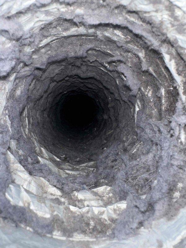 Completed dryer vent cleaning service for a residential property. Upon inspection, found significant lint and debris accumulation throughout the duct system, with multiple layers of fibrous material coating the interior walls and restricting airflow. Thoroughly cleaned the entire vent line from the dryer connection to the exterior termination point, removing all accumulated lint, dust, and debris to restore proper ventilation and reduce fire hazard risk.