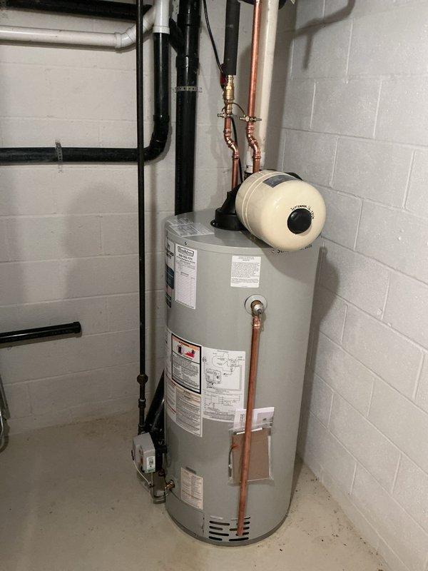 Responded to service call for newly installed tanked water heater with no hot water production. Upon arrival, inspected the basement installation including all plumbing connections, gas supply lines, copper piping, expansion tank, and electrical components. Diagnosed and resolved the operational issue preventing hot water delivery. Verified proper function of all connections including gas meter assembly, supply lines, pressure relief valve, and heating elements. System tested and confirmed fully operational with adequate hot water production restored.