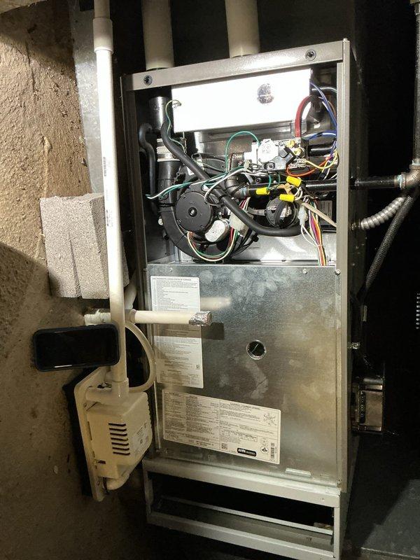 Completed routine MVP furnace maintenance visit, performing comprehensive inspection of heating system and associated components. Accessed and examined internal furnace cabinet, verifying proper operation of blower motor assembly, electrical connections, and control wiring. Inspected condensate pump system, PVC venting configuration, and all mechanical connections for proper function and compliance with manufacturer specifications.