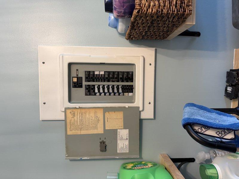 Completed installation of dedicated heat pump circuit with 100-amp meter socket and service cable upgrade. Work required two appointments due to parts availability, with specialized components ordered and received between visits. Installation included routing new electrical conduit through attic space and mounting updated circuit breaker panel to accommodate the increased electrical load requirements for the heat pump system.