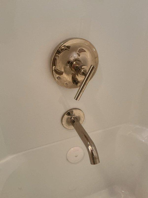 Responded to customer complaint of excessively hot water temperature from shower fixture. Inspected and adjusted the temperature control valve on the tub/shower assembly to regulate maximum hot water output. Tested water temperature after adjustment to ensure safe and comfortable water delivery, resolving the scalding water issue.