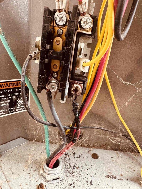 Responded to no cooling complaint on 6-year-old air conditioning system. Upon inspection, found compressor experiencing abnormally high inrush current reading of 68.4 amps, indicating compressor failure. Verified electrical connections at contactor and terminal block were secure with proper wire terminations. System unable to produce cold air due to failed compressor. Recommended compressor replacement or full condenser unit replacement based on age and repair cost considerations.