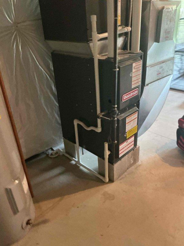 Responded to no-cooling complaint on 5-year-old residential air conditioning system. Upon arrival, performed comprehensive diagnostic evaluation of Goodman HVAC system. Inspected outdoor condensing unit and noted white residue on exterior casing with no evidence of frost formation or refrigerant freezing. Removed furnace access panel to examine indoor air handler components, blower motor operation, and electrical connections. Verified gas valve assembly, heat exchanger condition, and all wiring terminations were secure and functioning properly. System showed no immediate mechanical failures or refrigerant leaks. Documented equipment condition with photographs for service records. Provided second opinion assessment as requested.