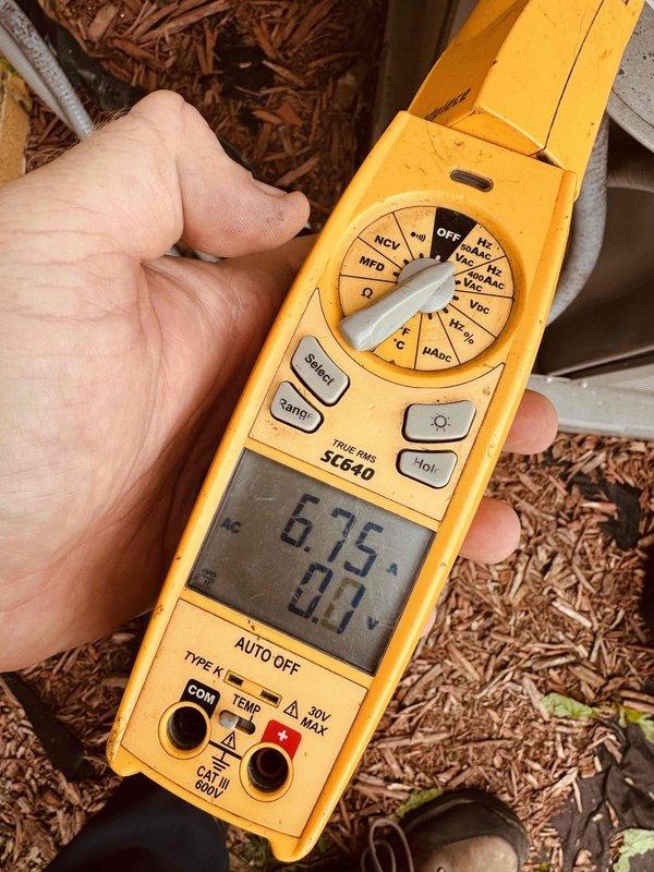 Performed electrical diagnostics on residential air conditioning system using clamp meter to verify voltage and capacitance readings. Inspected control panel components including capacitor, contactor, and associated wiring connections. Customer enrolled in maintenance program during service visit.