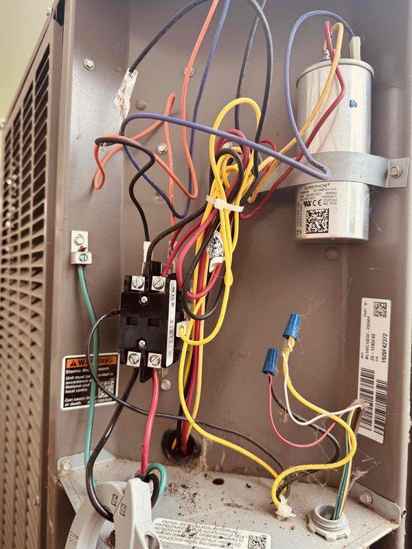Performed electrical diagnostics on residential air conditioning system using clamp meter to verify voltage and capacitance readings. Inspected control panel components including capacitor, contactor, and associated wiring connections. Customer enrolled in maintenance program during service visit.