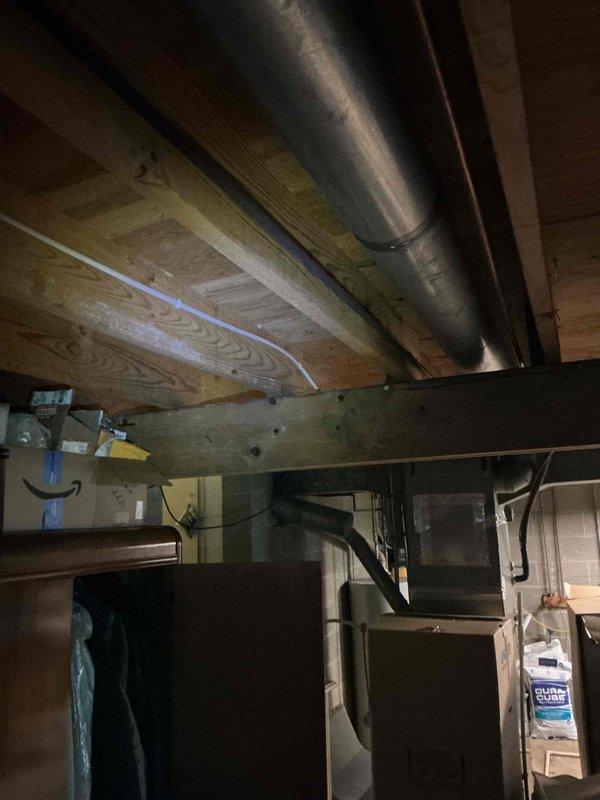 Completed electrical rewiring in basement utility area to accommodate new dishwasher installation. Ran new dedicated circuit with appropriate gauge wiring through exposed joist space, installed junction box, and verified all connections met code requirements for appliance load.